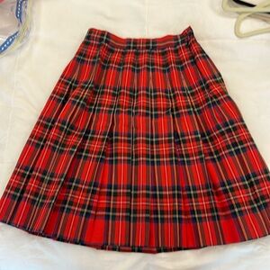 Pleated red plaid skirt. Absolutely adorable.
